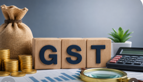 GST registration concept with calculator, coins, and GST blocks.
